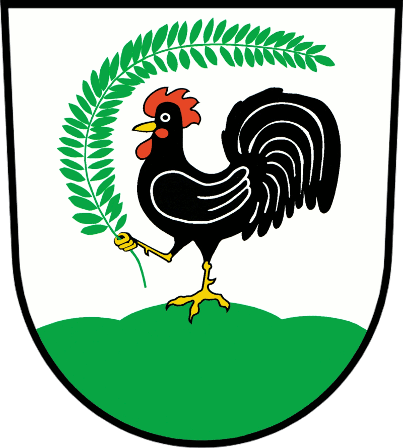 In Silber auf grünem Dreiberg stehend ein gold-bewehrter schwarzer Hahn mit rotem Kamm und Lappen, im erhobenen rechten Fuß einen nach links über den Kopf gebogenen grünen Zweig haltend.</br> <br /><br />
<br /><br />
<br /><br />
