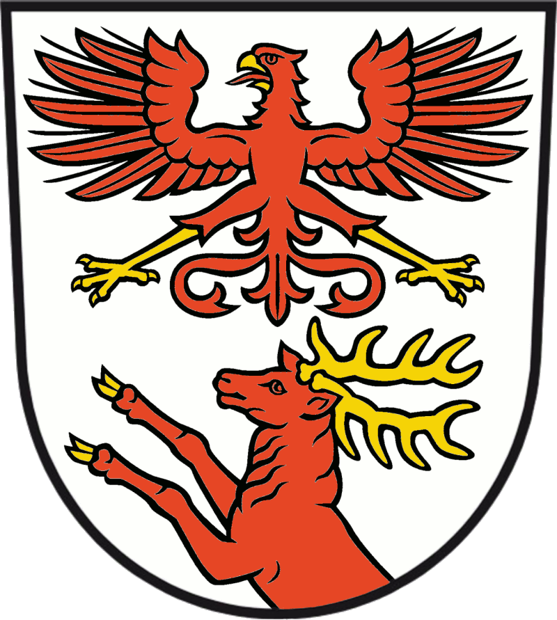 In Silber ein gold-bewehrter roter Adler über einem aus dem unteren Schildrand wachsenden gold-bewehrten roten Hirsch.<br>